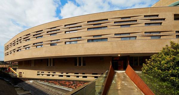 Exterior view of Chetham’s School of Music, with handmade brick cladding and walkway