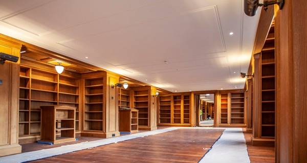 wide view of library and wood shelving