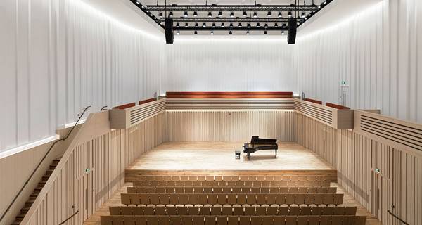 view of piano on stage at Chetham's Stoller Hall