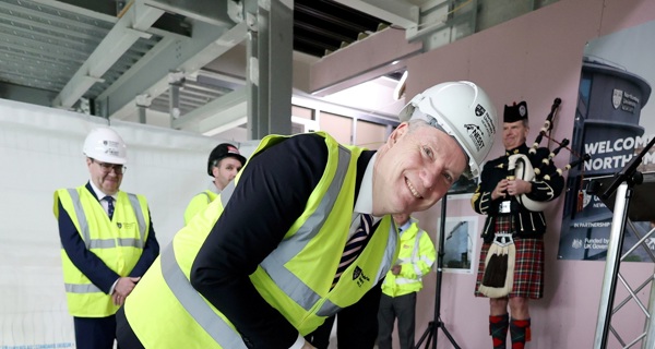 Ceremonial final concrete poured at NESST topping out