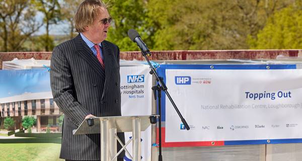 Sir Andrew McAlpine welcomes guests at NRC topping out