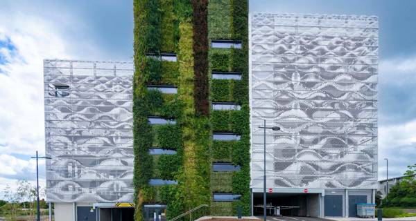 Exterior view of the north side of Farringdon Row Car Park, featuring a living wall filled with vibrant plants.