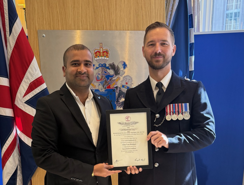 Aditya pictured receiving his award from the Acting BCU Commander Alan Duncan
