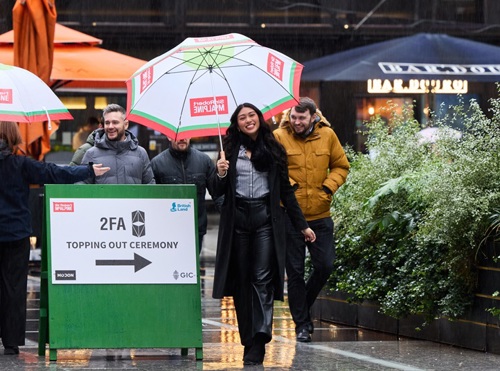 Victoria Inglis smiling holding an umbrella