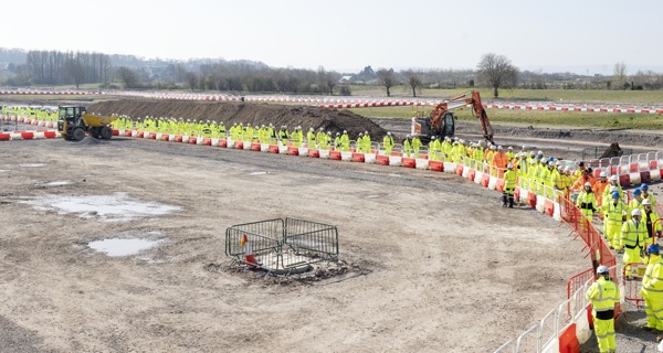 Site workers lining up to attend the ceremony