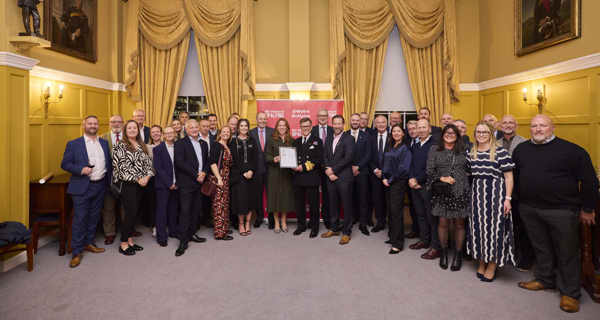 Employees of Sir Robert McAlpine pose for a picture with the Armed Forces Covenant ERS Silver Award