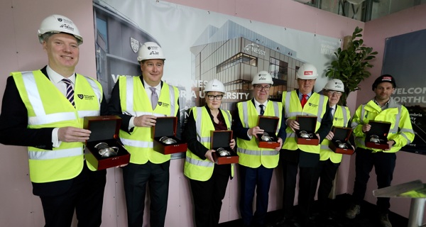 Delegates pose for a photo at NESST topping out