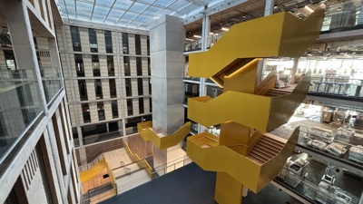 The statement yellow atrium stairs inside Temple Quarter Enterprise Campus