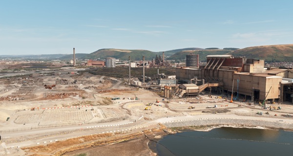 A drone view of piling at Port Talbot against the backdrop of hills