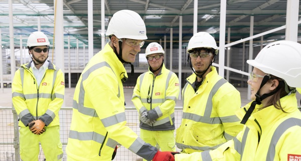 Peter Kyle MP shakes hands with an SRM apprentice