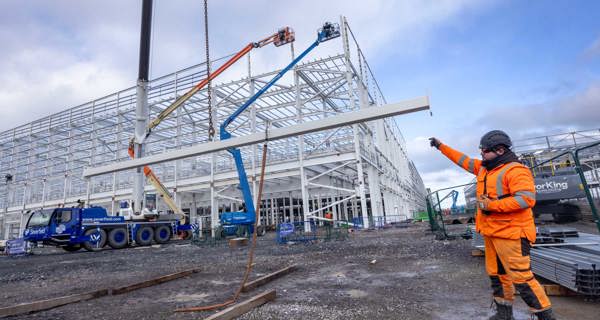 Steel frame lifting into place.