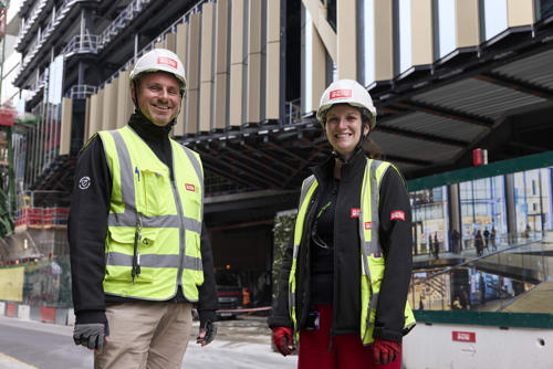 Angela Beckwith and Mark Nicholls pose for a photograph outside 2 Finsbury Avenue